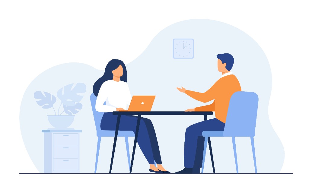 Consultation meeting between two people at a desk